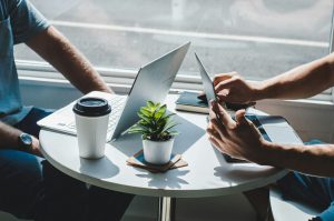 Two people working at a cafe.